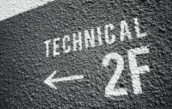 Image of Techincal 2f and arrow painted on wall